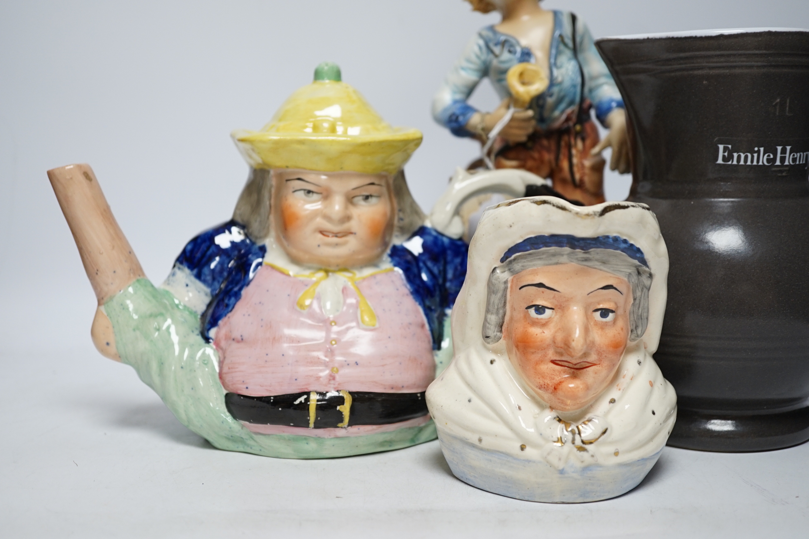 A Capodimonte figure, a Staffordshire pottery teapot, a jug and a Beswick pig